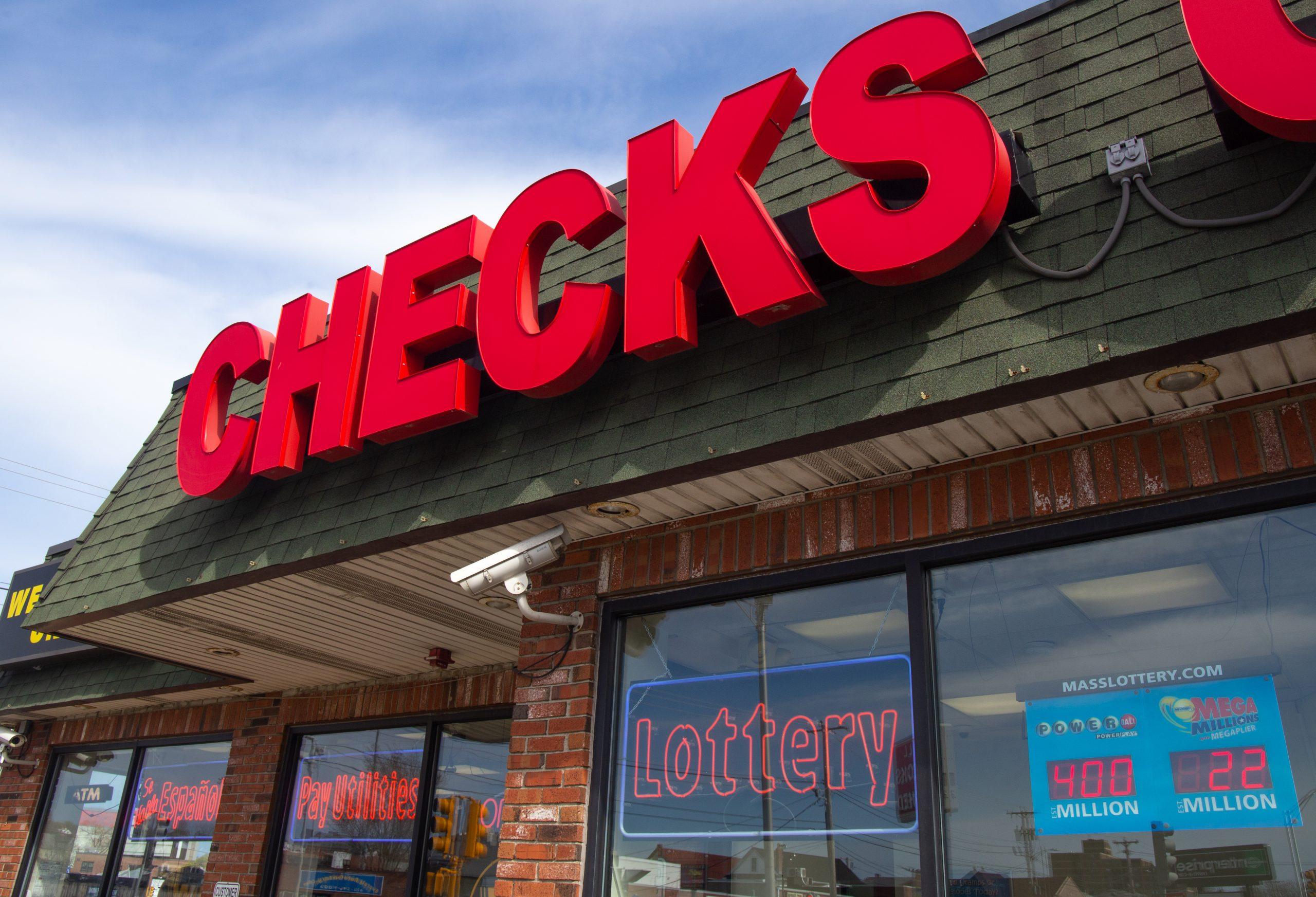 A photo of a check-cashing store advertising lottery tickets.