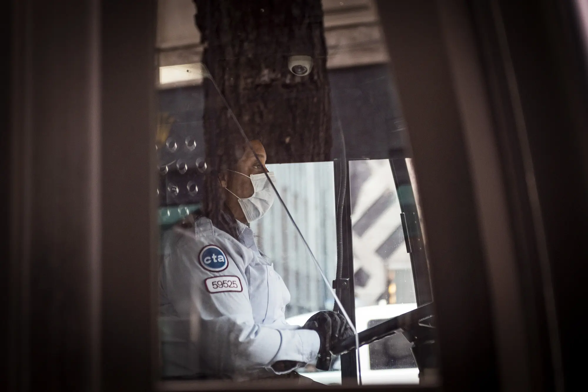 A photo of a person driving a bus.